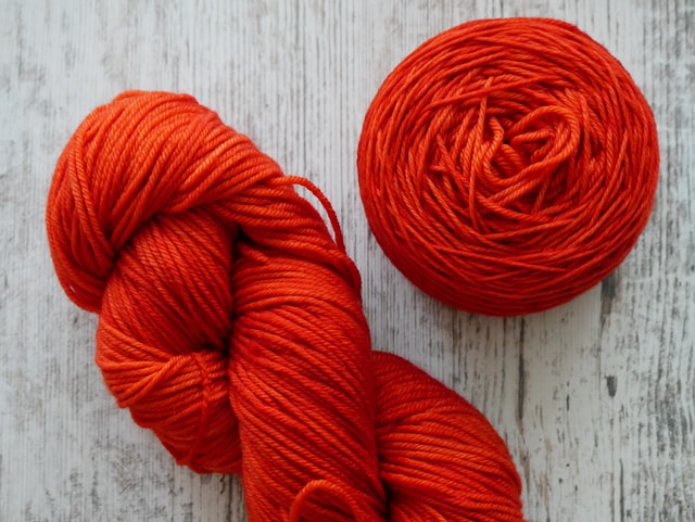 orange yarn skein and cake