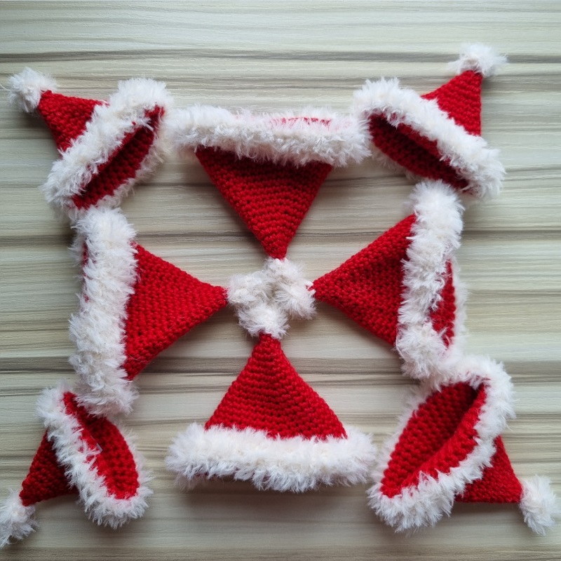 mini crochet santa hats in a snowflake pattern