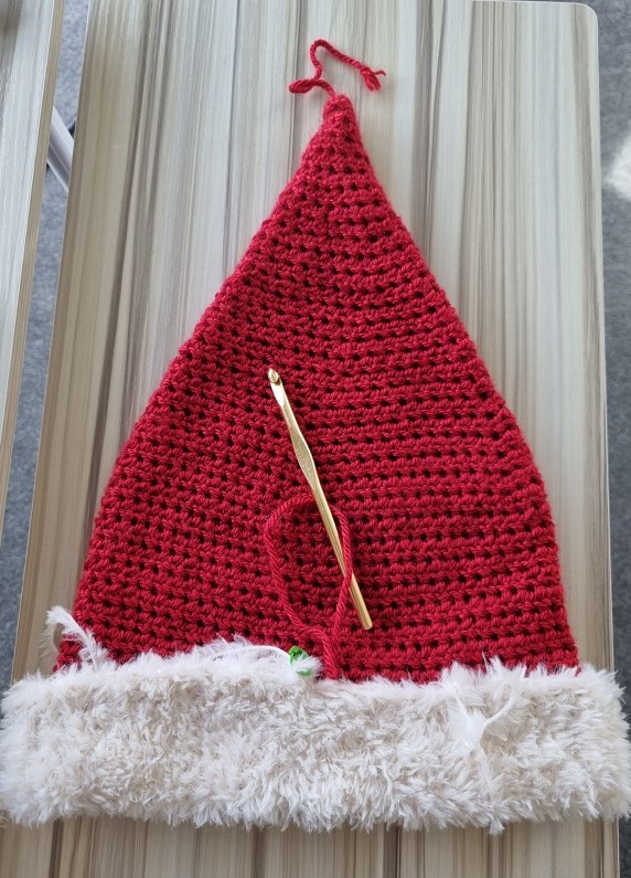 mostly finished crochet santa hat