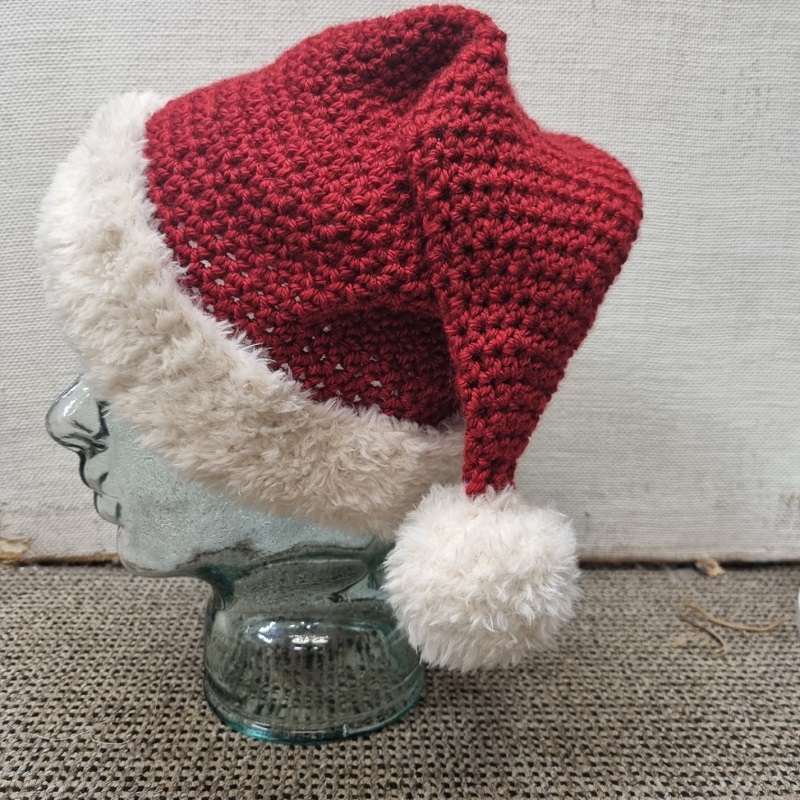 crochet santa hat on mannequin